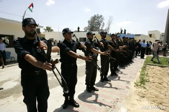 Palestinian Hamas security forces stand guard during opening the headquarters of the new Palestinian police, which was rebuilt after destroyed in the Israeli war on Gaza in 2008-2009 in Rafah, southern Gaza Strip on June...