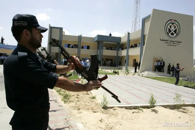 Palestinian Hamas security forces stand guard during opening the headquarters of the new Palestinian police, which was rebuilt after destroyed in the Israeli war on Gaza in 2008-2009 in Rafah, southern Gaza Strip on June...