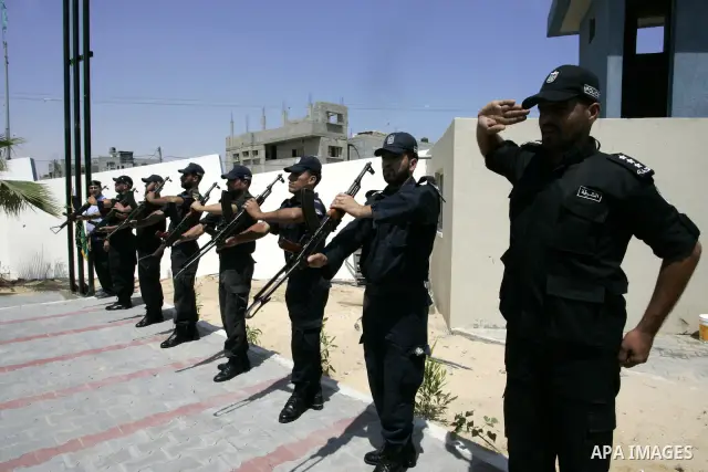 Palestinian Hamas security forces stand guard during opening the headquarters of the new Palestinian police, which was rebuilt after destroyed in the Israeli war on Gaza in 2008-2009 in Rafah, southern Gaza Strip on June...