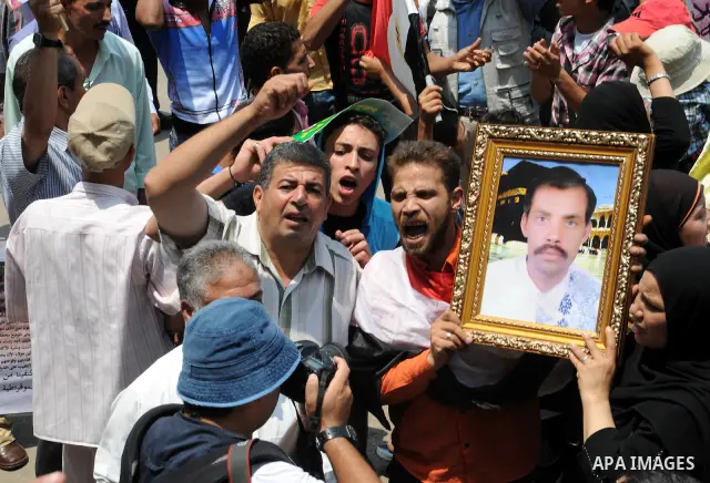 Egyptians take part in a rally after prayer at Tahrir Square in Cairo, Egypt, on July 1, 2011. Hundreds of people were rallying in the square, that was the epicenter of the uprising that toppled Hosni Mubarak, demanding...