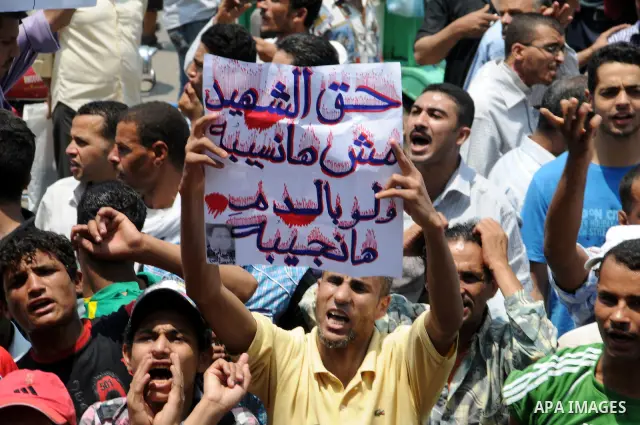 Egyptians take part in a rally after prayer at Tahrir Square in Cairo, Egypt, on July 1, 2011. Hundreds of people were rallying in the square, that was the epicenter of the uprising that toppled Hosni Mubarak, demanding...