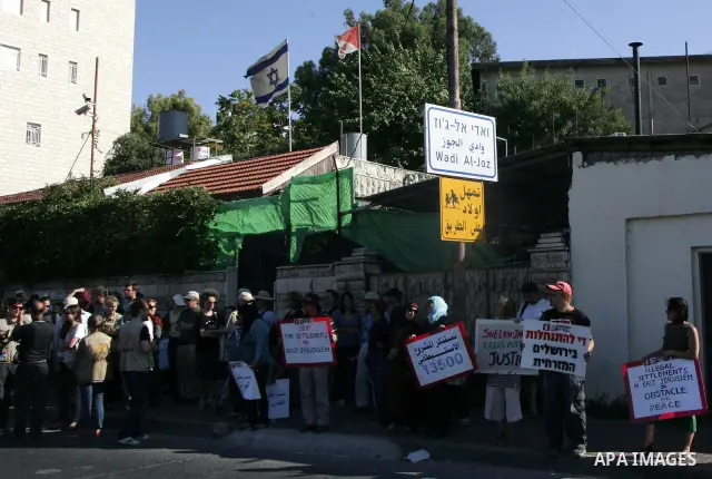 Israeli, Palestinian and foreign activists take part in a weekly demonstration against Israel's occupation of Palestinian land on July 1, 2011 in the mostly Arab Jerusalem neighborhood of Sheikh Jarrah. Photo by Mahfouz...