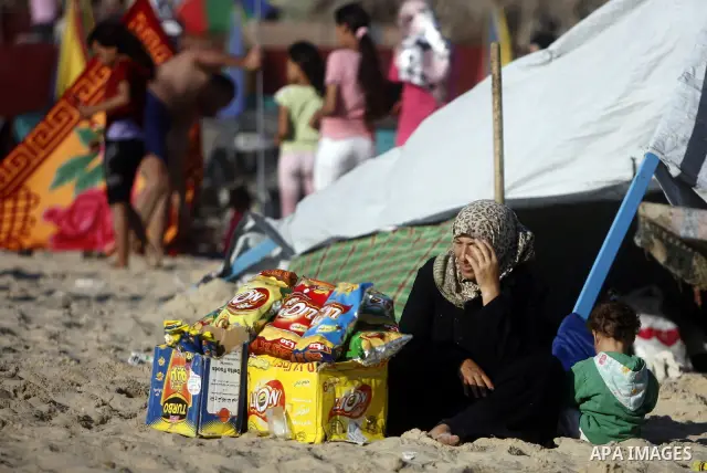 Palestinians enjoy swimming in the sea on Gaza's beach on July 1, 2011 in Gaza City. Photo by Ali Jadallah