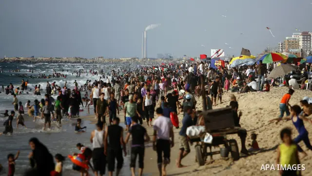 Palestinians enjoy swimming in the sea on Gaza's beach on July 1, 2011 in Gaza City. Photo by Ali Jadallah