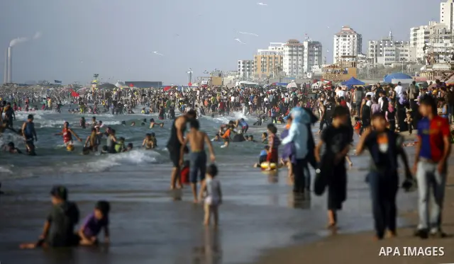 Palestinians enjoy swimming in the sea on Gaza's beach on July 1, 2011 in Gaza City. Photo by Ali Jadallah