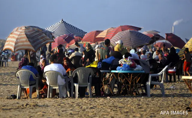 Palestinians enjoy swimming in the sea on Gaza's beach on July 1, 2011 in Gaza City. Photo by Ali Jadallah