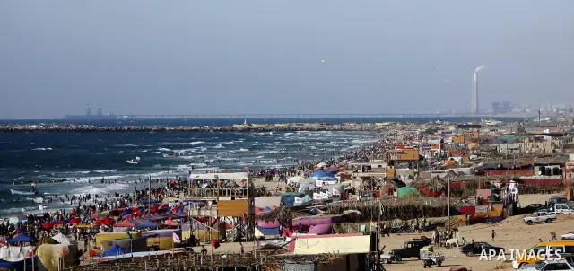 Palestinians enjoy swimming in the sea on Gaza's beach on July 1, 2011 in Gaza City. Photo by Ali Jadallah