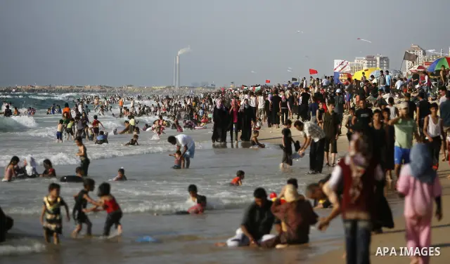 Palestinians enjoy swimming in the sea on Gaza's beach on July 1, 2011 in Gaza City. Photo by Ali Jadallah