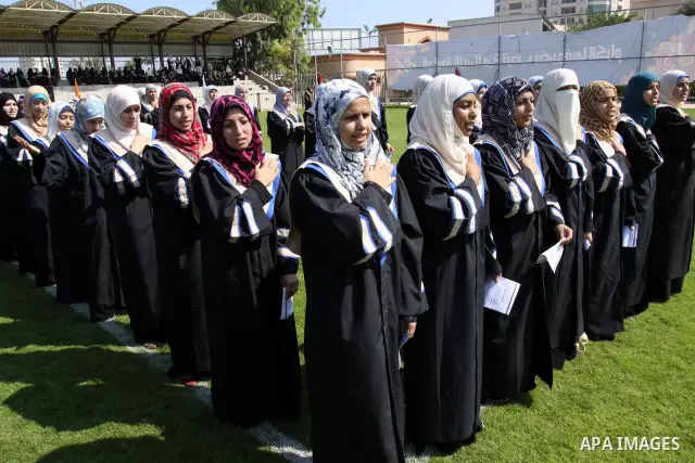 Palestinian students are seen during their training in preparation for graduation ceremony that starting tomorrow in the Islamic University in Gaza city on July 3, 2011. Photo by Mohammed Asad