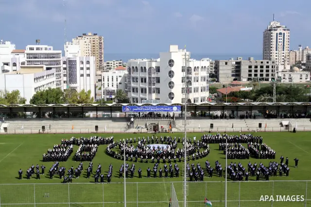 Palestinian students are seen during their training in preparation for graduation ceremony that starting tomorrow in the Islamic University in Gaza city on July 3, 2011. Photo by Mohammed Asad
