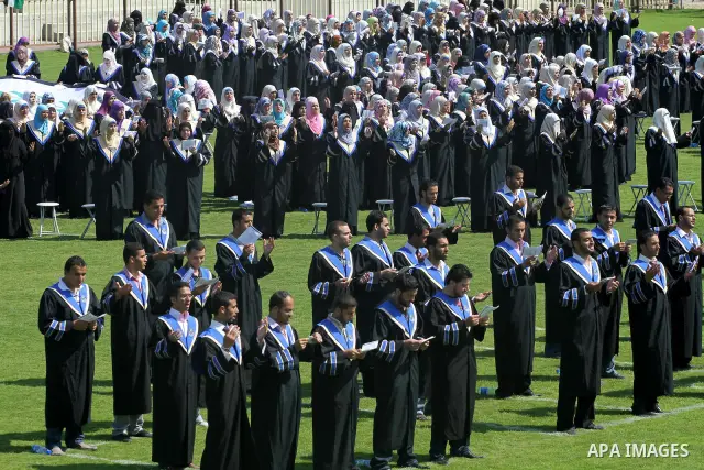 Palestinian students are seen during their training in preparation for graduation ceremony that starting tomorrow in the Islamic University in Gaza city on July 3, 2011. Photo by Mohammed Asad