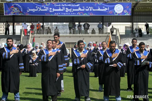 Palestinian students are seen during their training in preparation for graduation ceremony that starting tomorrow in the Islamic University in Gaza city on July 3, 2011. Photo by Mohammed Asad