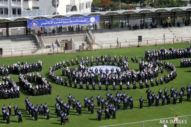 Palestinian students are seen during their training in preparation for graduation ceremony that starting tomorrow in the Islamic University in Gaza city on July 3, 2011. Photo by Mohammed Asad