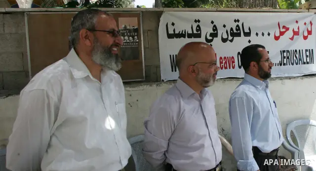 Palestinian Hamas legislators Ahmed Atun, Mohammed Totah and Khaled Abu Arafa receive Palestinian supporters at the Red Cross compound in east Jerusalem on July 3, 2011. The Hamas MPs live inside the compound for the pas...