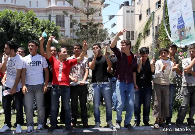 Palestinian students take a part in a protest in front of the headquarters of the Ministry of Education after the end of exams and they object to the difficulty of the exams in Gaza city on July 4, 2011. Photo by Mohamme...