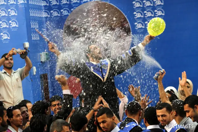 Palestinian students participate in their graduation ceremony at the Islamic University in Gaza city on July 4,2011. Photo by Mohammed Asad