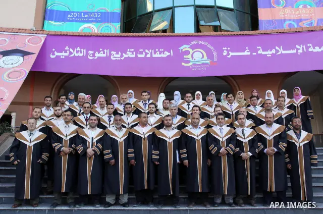 Palestinian students participate in their graduation ceremony at the Islamic University in Gaza city on July 4,2011. Photo by Mohammed Asad