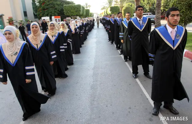 Palestinian students participate in their graduation ceremony at the Islamic University in Gaza city on July 4,2011. Photo by Mohammed Asad