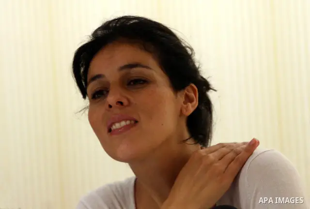 Souad Massi, Algerian singer and songwriter living in France, speaks during a press conference ahead of her concert during the Palestine International Festival 2011, in the West Bank city of Ramallah, Tuesday, July 5, 20...