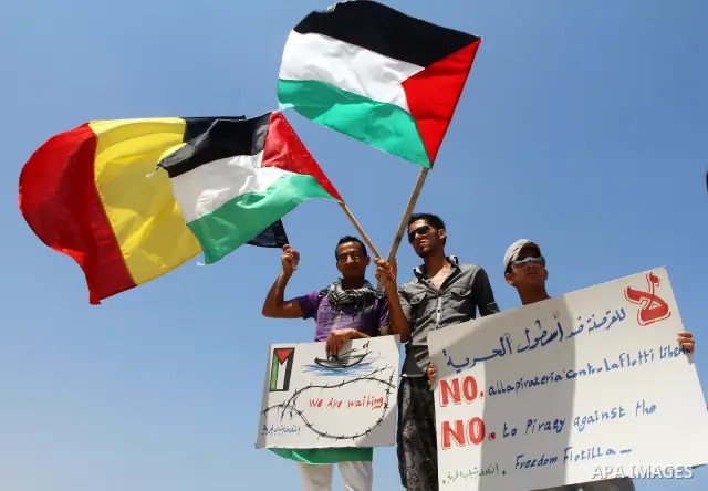 Palestinians take part in a rally to show solidarity with the "Freedom Flotilla II" at Gaza seaport July 6, 2011. Pro-Palestinian activists hoping to sail to Gaza this week fully expected their flotilla to be blocked by...
