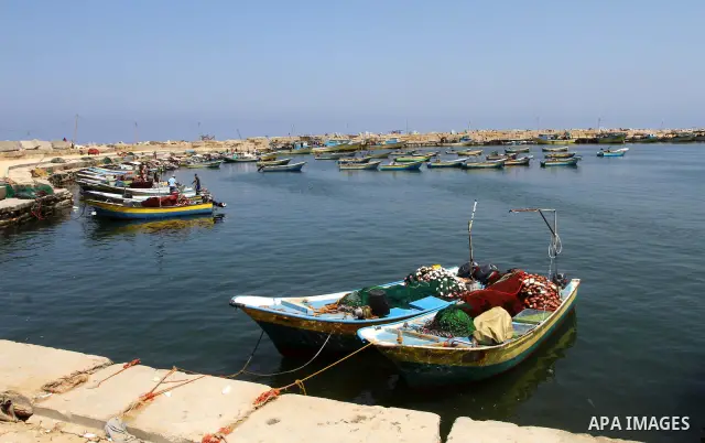 Palestinian fishermen ride their boats at Gaza seaport July 6, 2011. Pro-Palestinian activists hoping to sail to Gaza this week fully expected their flotilla to be blocked by Israeli marines. Photo by Ashraf Amra