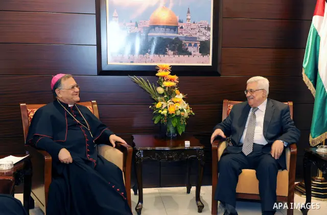 Palestinian President Mahmoud Abbas (Abu Mazen) meets with Patriarch, Fouad Tawal in the West Bank city of Ramallah on July 6, 2011. Photo by Mufeed Abu Hasnah.