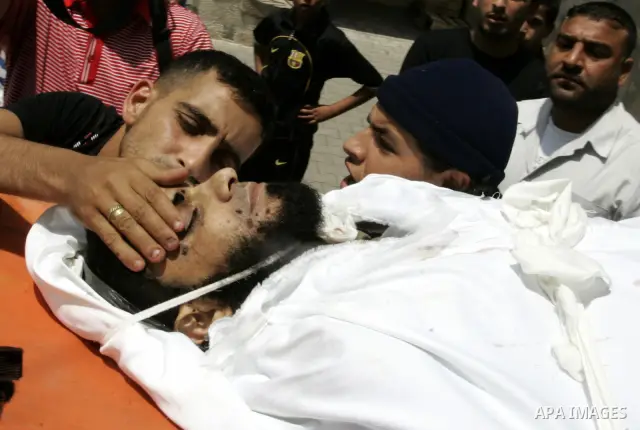 Palestinian relatives carry the body of Kamal Hamdan Muammar, 28-years-old, for burial following prayers at the mosque in the Rafah refugee camp, in the southern of Gaza Strip, on July 6, 2011, after being killed along w...