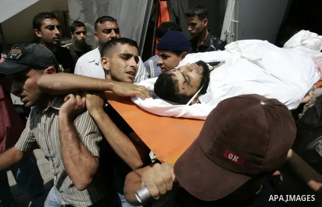 Palestinian relatives carry the body of Kamal Hamdan Muammar, 28-years-old, for burial following prayers at the mosque in the Rafah refugee camp, in the southern of Gaza Strip, on July 6, 2011, after being killed along w...