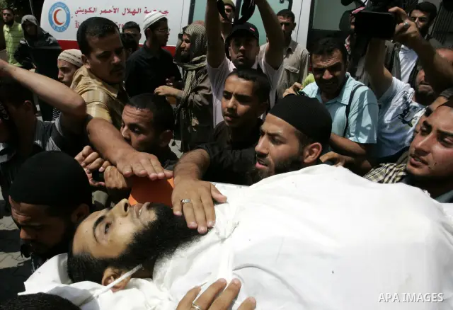 Palestinian relatives carry the body of Mohammed Said Abu Jazar, 28-years-old, for burial following prayers at the mosque in the Rafah refugee camp, in the southern of Gaza Strip, on July 6, 2011, after being killed alon...