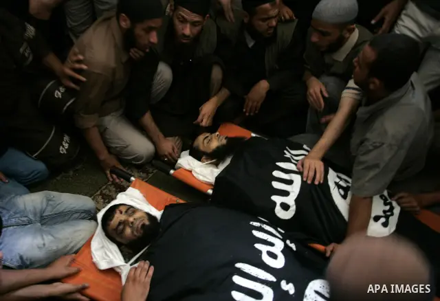 Palestinian relatives and friends of Kamal Hamdan Muammar and Mohammed Said Abu Jazar, both 28-years-old, ready to bury them following prayers at the mosque in the Rafah refugee camp, in the southern of Gaza Strip, on Ju...