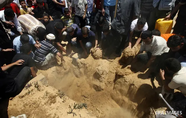 Palestinian relatives mourn the body of Kamal Hamdan Muammar, 28-years-old, for burial following prayers at the mosque in the Rafah refugee camp, in the southern of Gaza Strip, on July 6, 2011, after being killed along w...