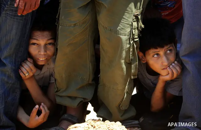 Palestinian relatives mourn the body of Kamal Hamdan Muammar, 28-years-old, for burial following prayers at the mosque in the Rafah refugee camp, in the southern of Gaza Strip, on July 6, 2011, after being killed along w...