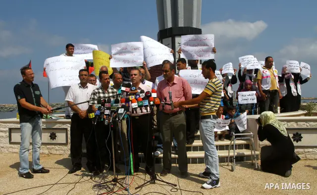 Palestinians deliver speech in a rally to show solidarity with the "Freedom Flotilla II" at Gaza seaport on July 7, 2011. Pro-Palestinian activists hoping to sail to Gaza this week fully expected their flotilla to be blo...