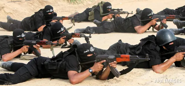 Palestinian militants of al-Ansar brigades, the military wing of al-Ahrar movement, take part in a military parade in Khan Younis in the southern Gaza Strip on July 7, 2011, to mark the fifth anniversary of their group's...