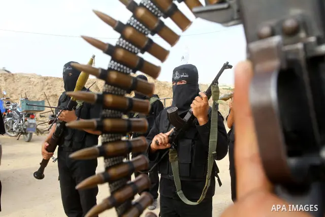 Palestinian militants from Al-Ansar brigades, the armed wing of Al-Ahrar movement, demonstrate their skills during a drill in front of the media in Khan Younis in the southern Gaza Strip July 7, 2011. Photo by Ashraf Amr...