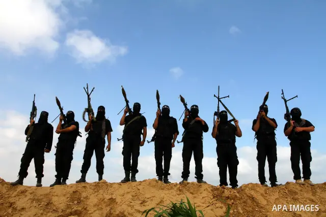 Palestinian militants from Al-Ansar brigades, the armed wing of Al-Ahrar movement, demonstrate their skills during a drill in front of the media in Khan Younis in the southern Gaza Strip July 7, 2011. Photo by Ashraf Amr...