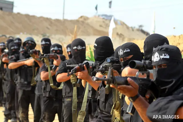 Palestinian militants from Al-Ansar brigades, the armed wing of Al-Ahrar movement, demonstrate their skills during a drill in front of the media in Khan Younis in the southern Gaza Strip July 7, 2011. Photo by Ashraf Amr...