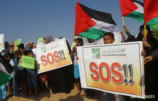 Palestinians take Part during a protest in the port at Gaza City on July 7, 2011. Pro-Palestinian activists hoping to sail to Gaza this week fully expected their flotilla to be blocked by Israeli marines. Photo by Ashraf...