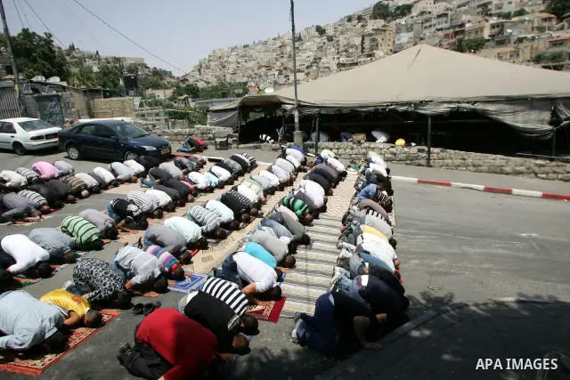 Palestinians attend Friday prayers at the protest tent in the Silwan neighborhood in East Jerusalem on July 8,2011 as Palestinian protesters gather for a demonstration. Photo by Mahfouz Abu Turk