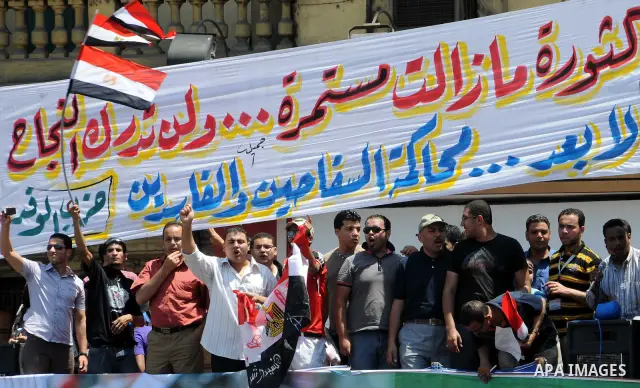 Protesters gather in Tahrir square in Cairo July 8, 2011. Thousands of Egyptians gathered in Cairo's Tahrir Square on Friday to demand faster reforms and the swifter prosecution of former officials from Hosni Mubarak's t...