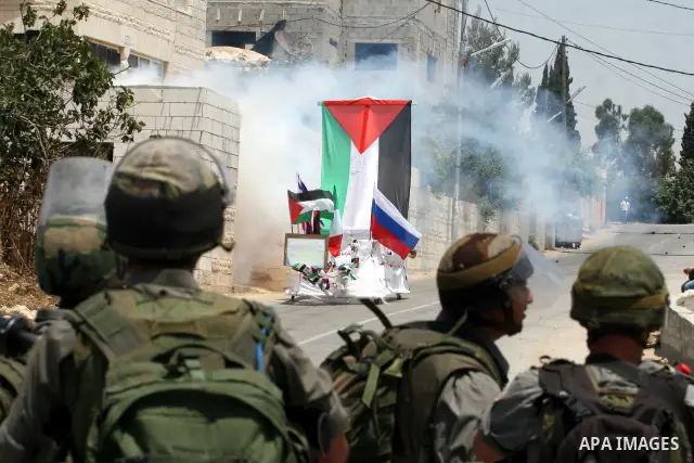 Israeli soldiers clash with Palestinian protesters from the West Bank village of Nabi Saleh, north of Ramallah, on July 8, 2011, during the weekly Friday protest against Israeli West Bank settlement expansion. Photo by I...