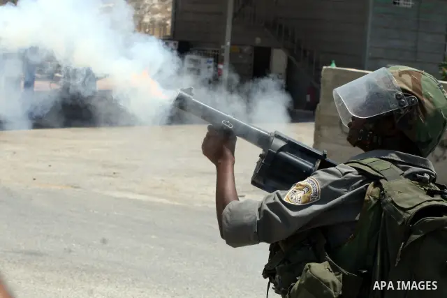 Israeli soldiers clash with Palestinian protesters from the West Bank village of Nabi Saleh, north of Ramallah, on July 8, 2011, during the weekly Friday protest against Israeli West Bank settlement expansion. Photo by I...