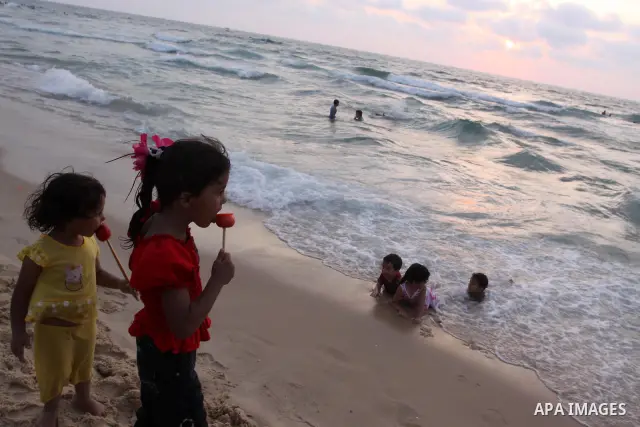 Palestinians enjoy swimming in the sea on Gaza's beach on on July 8, 2011. Reports state that during the summer the beach is a major venue for entertainment and leisure in the Gaza. Photo by Mohammed Asad
