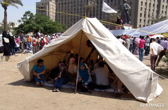 Egyptian protesters camp in Tahrir square in Cairo July 9, 2011. Thousands of Egyptians packed city centres across the country since Friday to demand faster reforms and voice frustration at what they regard as foot-dragg...