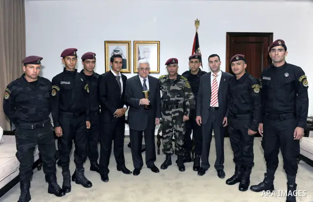 Palestinian President Mahmoud Abbas (Abu Mazen) .the delegation of the Presidential Guard champions of the military tai boxing in the West Bank city of Ramallah on July 9, 2011. Photo by Thaer Ganaim