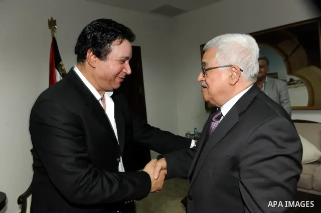 Palestinian President Mahmoud Abbas (Abu Mazen) meets with the artist Eman El Bahr Darwish in the West Bank city of Ramallah on July 10, 2011. Photo by Mufeed Abu Hasnah