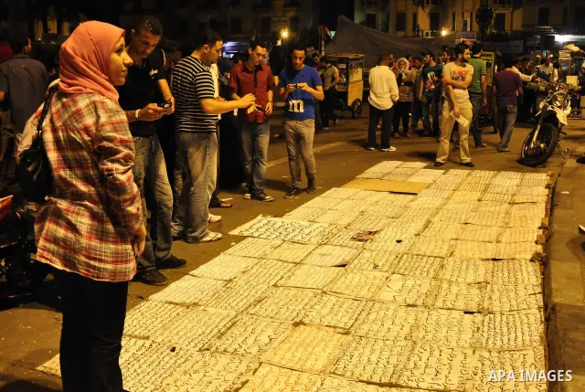 Hundreds of demonstrators gather as they spend their second night in Cairo's Tahrir Square, on July 10, 2011, at the landmark square vowing to keep up their sit-in despite a series of concessions by the Egyptian prime mi...