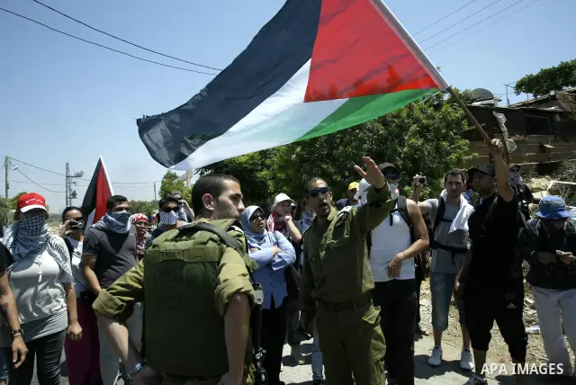 Palestinian and foreign protesters demonstrate against Israeli occupation and settlements on July 11, 2011in the village of Ezbet Tabeeb near the West Bank town of Qalqilya. Photo by Wagdi Eshtayah