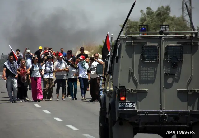 Palestinian and foreign protesters demonstrate against Israeli occupation and settlements on July 11, 2011in the village of Ezbet Tabeeb near the West Bank town of Qalqilya. Photo by Wagdi Eshtayah