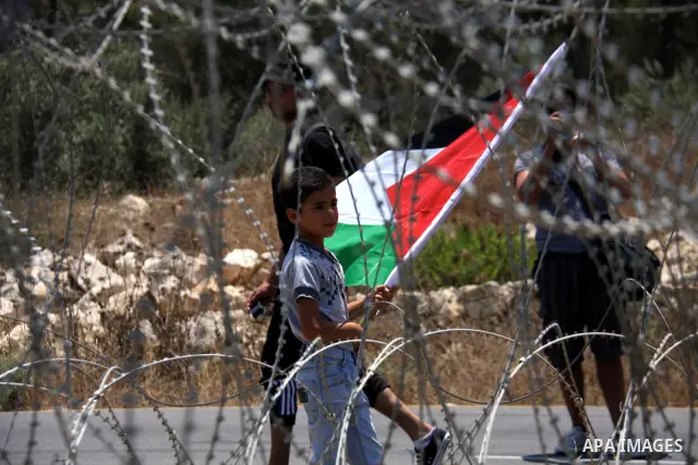 Palestinian and foreign protesters demonstrate against Israeli occupation and settlements on July 11, 2011in the village of Ezbet Tabeeb near the West Bank town of Qalqilya. Photo by Wagdi Eshtayah